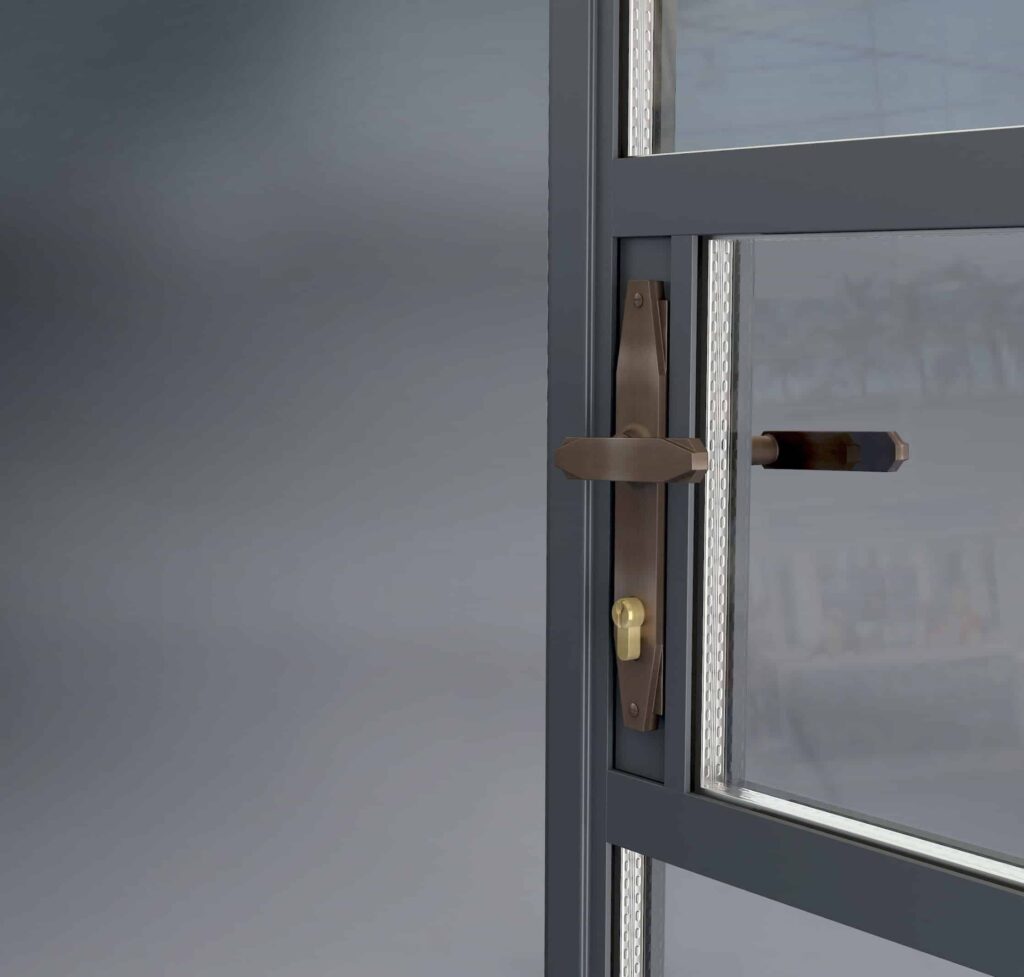 picture of an open door focusing on the door handle in a brass colour.