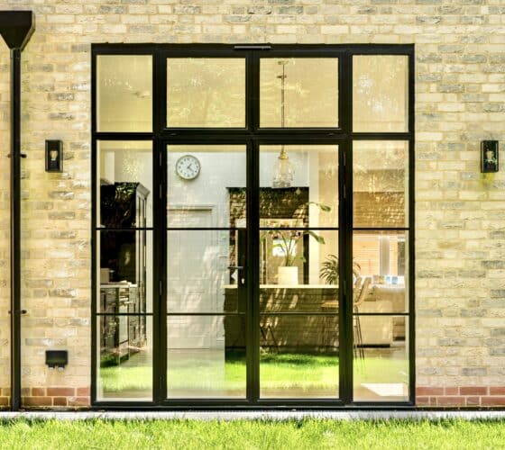 Aluco floating lock design with glazing bars for aluco exterior doors showing doors in a brick opening