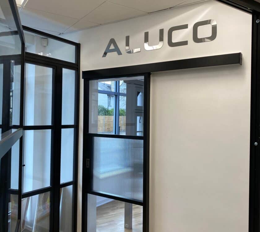 aluco internal sliding doors sliding in front of a wall
