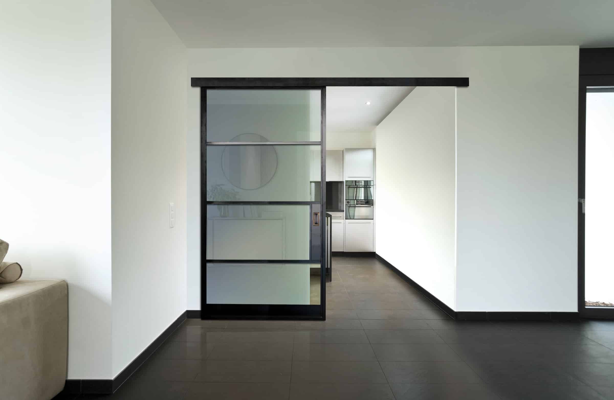 aluco interior sliding doors in a kitchen lounge partition