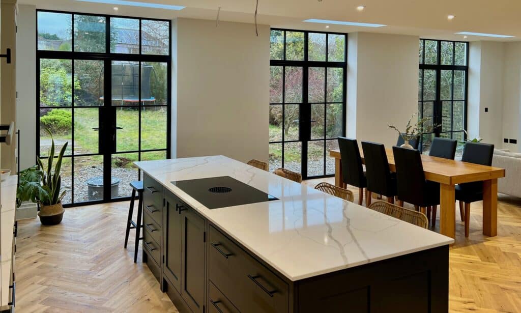 aluco ultra slim steel look exterior doors in a dining room extension.