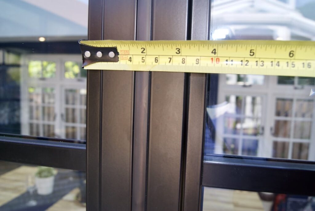 aluco steel-look bifolds showing tape measure and profile dimension.