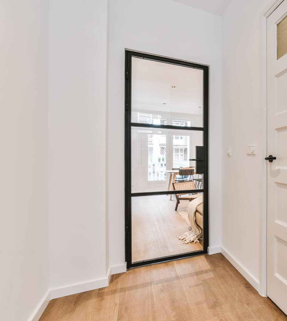 steel look interior doors in a slimline style between a hallway and lounge for single glazed or double glazed information article