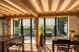 ultra slim steel look exterior doors in a country kitchen with oak beams