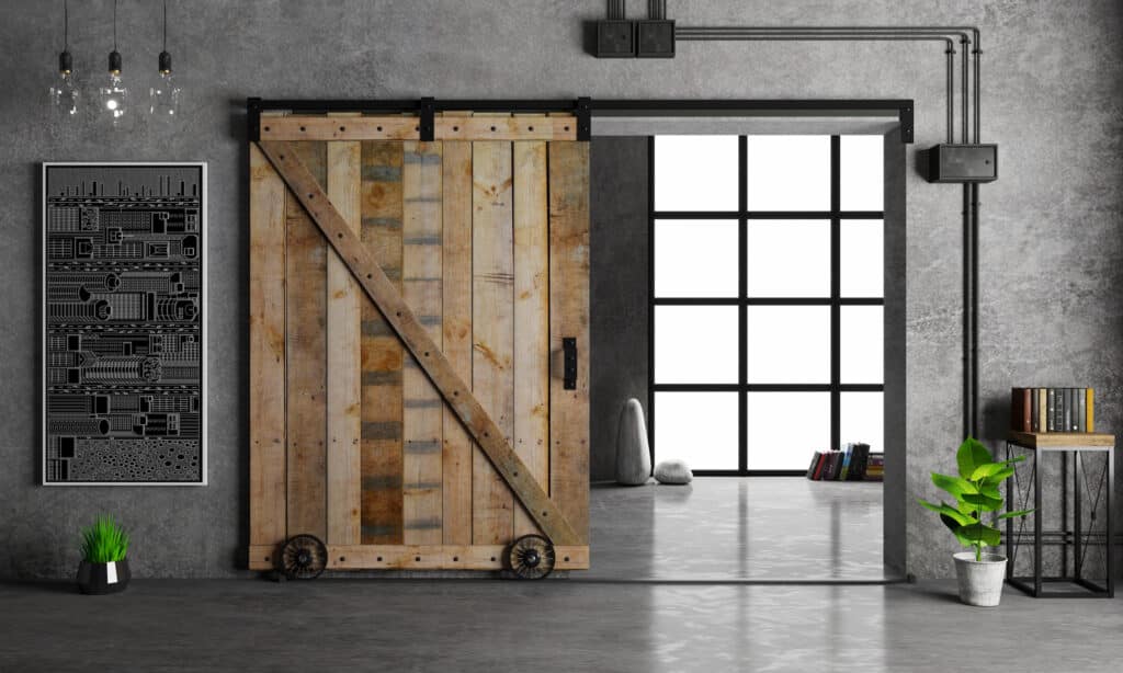 industrial style concept showing a sliding wood door, metal and glass.