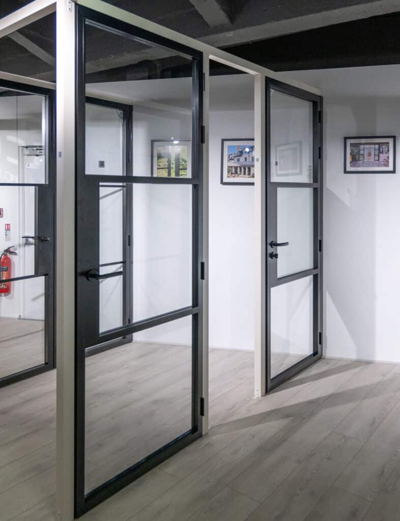 black aluco aluminium internal single doors on a display stand