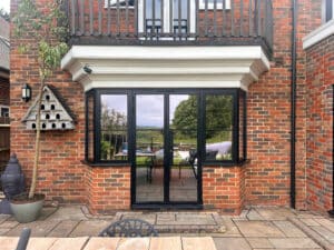 steel look windows in Kent house with patio doors.