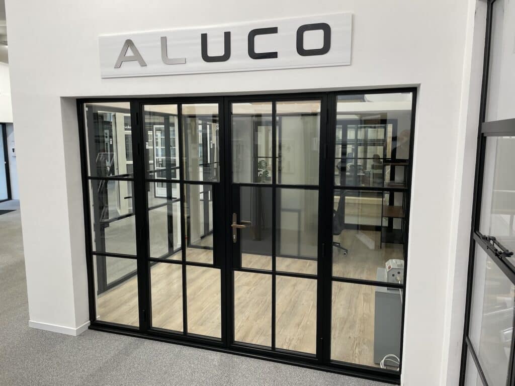 aluco steel look doors with side panels in bristol showroom